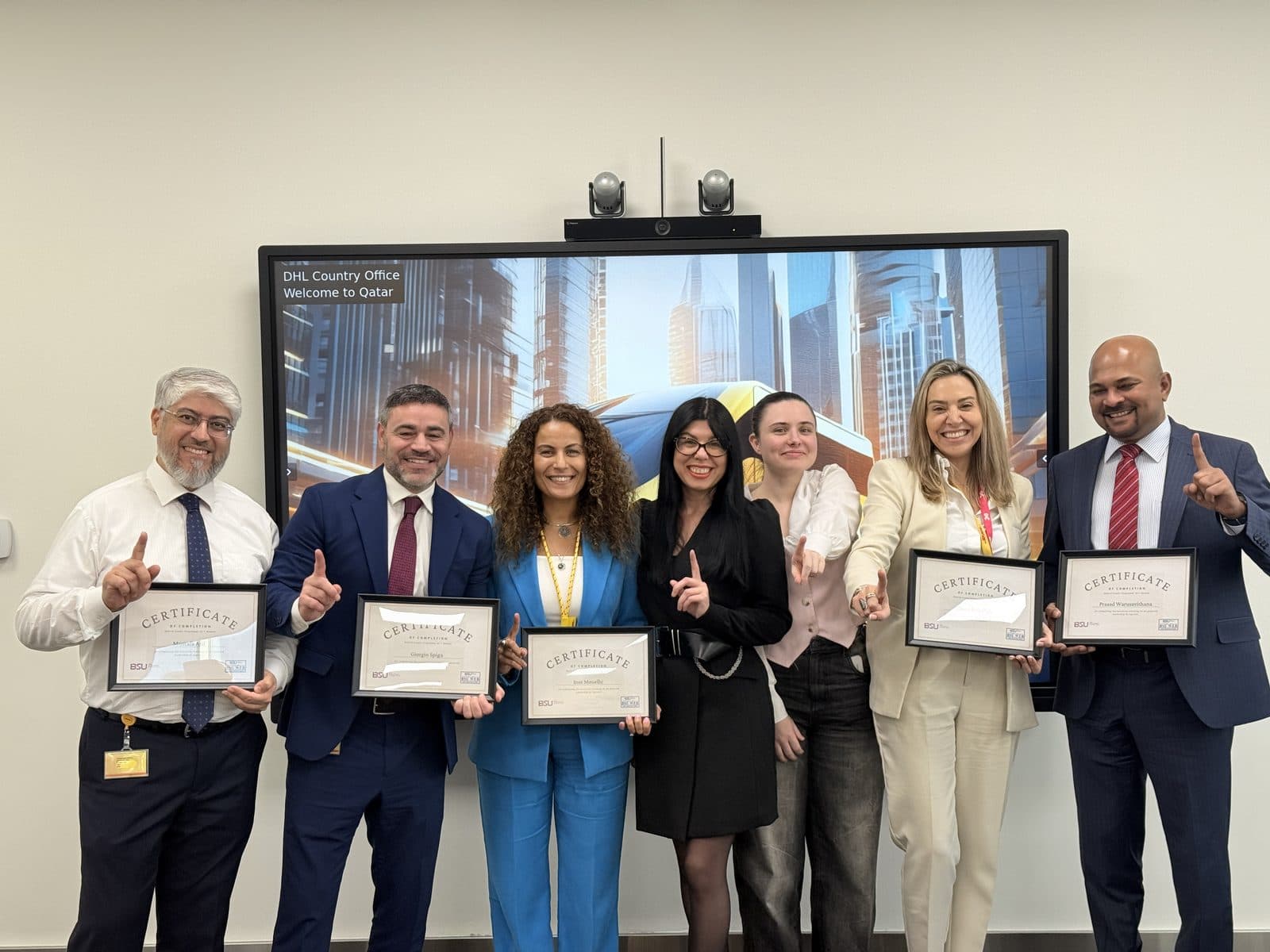 DHL Qatar Board of Directors receiving their AI literacy certification